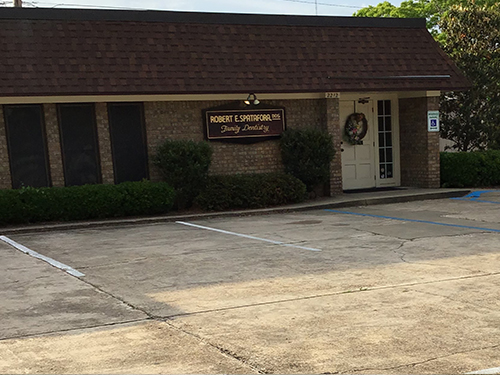 The image shows a sign with the text  KOREAN EXPRESS  in front of a building, which appears to be a small storefront.